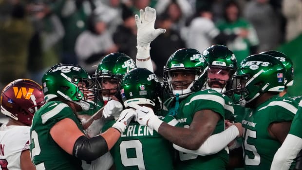 Jets mob kicker Greg Zuerlein after his game-winning 54-yard field goal vs. Washington